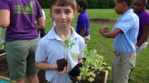 Student excited about planting his class garden!