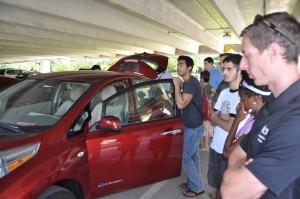 Learning about the Nissan Leaf and quick charger at the FREEDM Center.