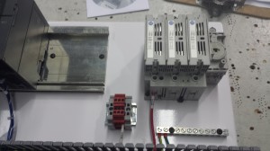 This is a step down transformer, it takes the power from the wall and decreases it to 24V to go to the other power supply