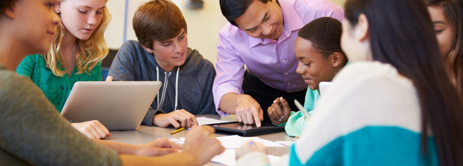 Image of teacher leader working with a group of students.