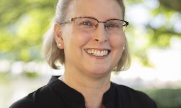 Headshot of Tammy King wearing a black blouse