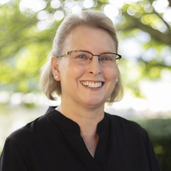 Headshot of Tammy King wearing a black blouse