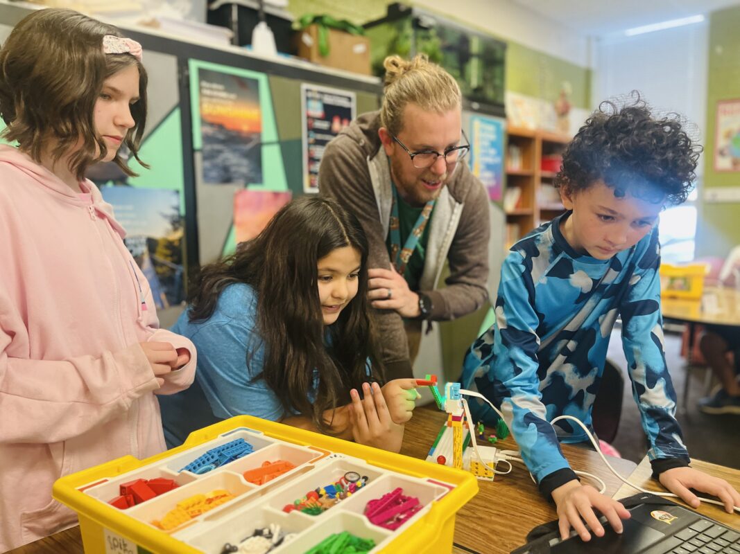 Kenan Fellow and his students work on a project in his classroom.