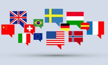 Multilingual graphic. Gray background with international flags and chat boxes.