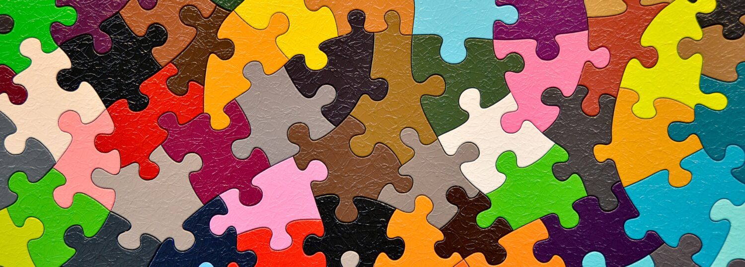 close up of colorful jigsaw puzzle pieces