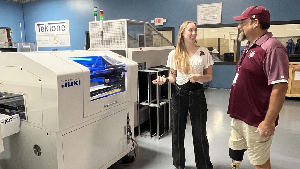Swain High teacher, counselor and coach Ian Roper tours TekTone with his industry mentor as part of his Kenan fellowship.