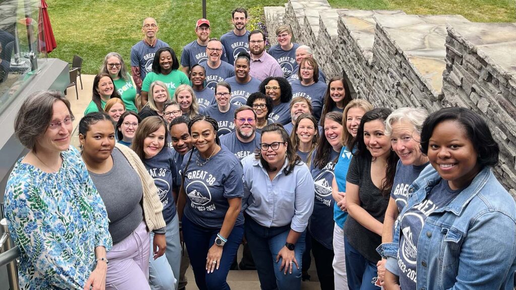Group photo of Kenan Fellow, teacher leaders, outside of the alumni center at NC State.