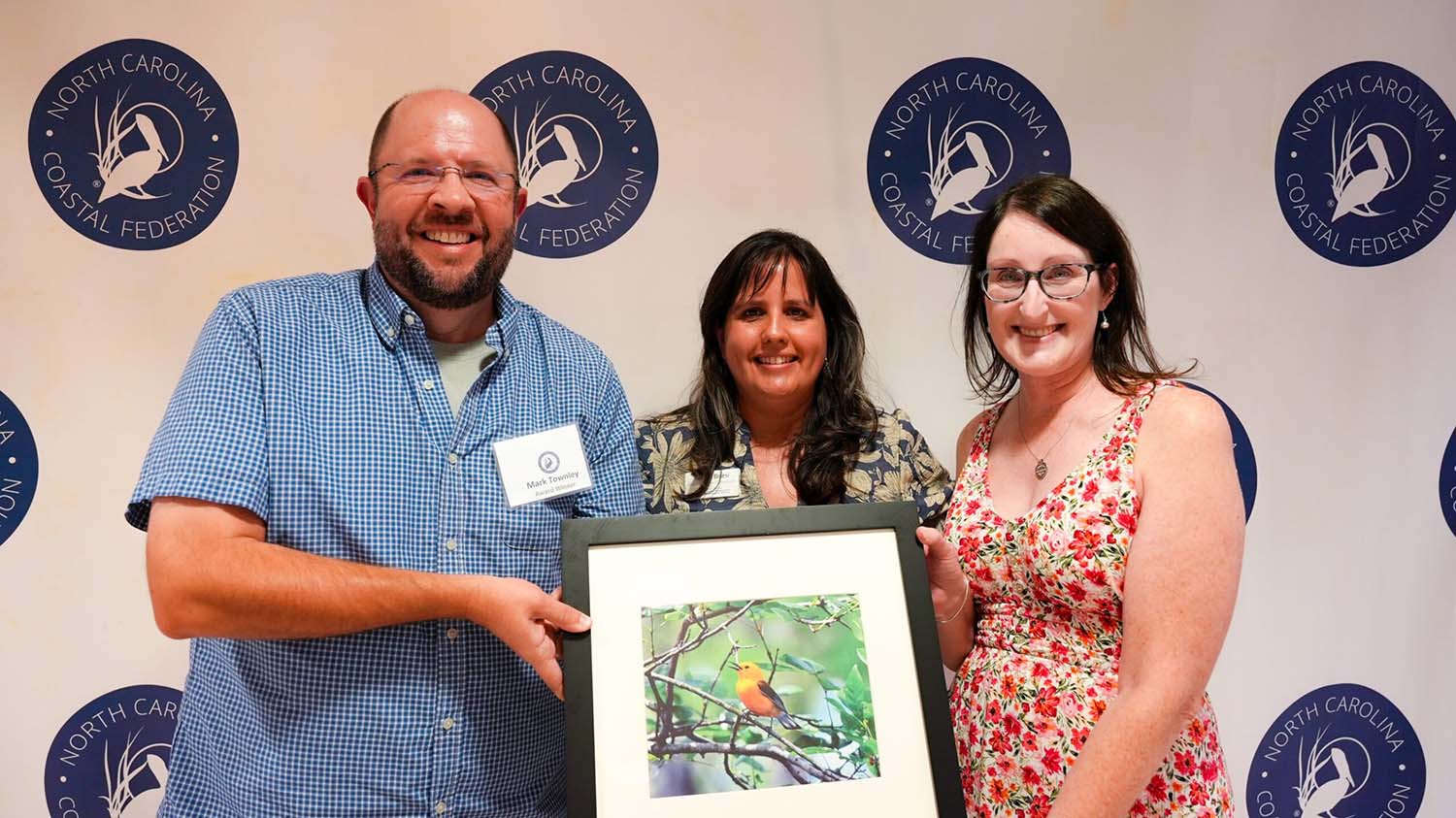 Kenan Fellows staff members Mark Townely and Carrie Horton accept the Pelican Award on behalf of the Kenan Fellows Program for Teacher Leadership.