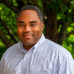 Outdoor headshot of Elijah Watson