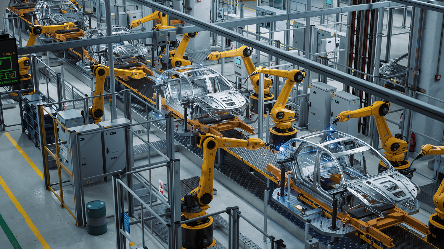 Automated Robot Arm Assembly Line Manufacturing High-Tech Green Energy Electric Vehicles.