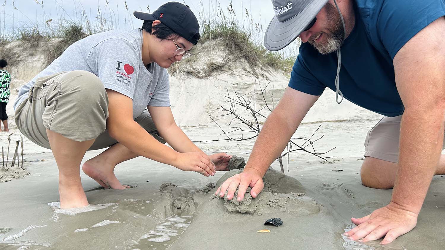 Teachers engage in a living seashore activity as part of the Mountains to Sea professional development workshop