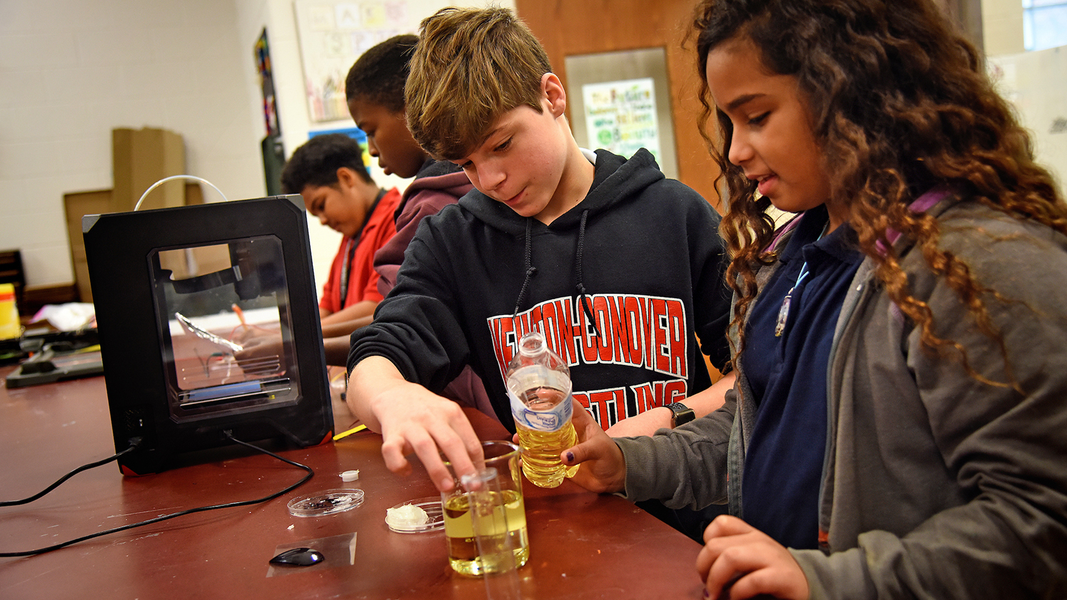 Newton-Conover middle school students perform science experiments with equipment provided by The Science House. NC State University photo.