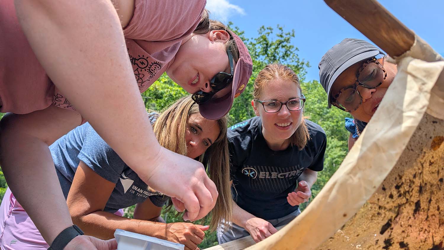 Teachers engage in a water quality activity in the North Carolina mountians during the Summer Institute.
