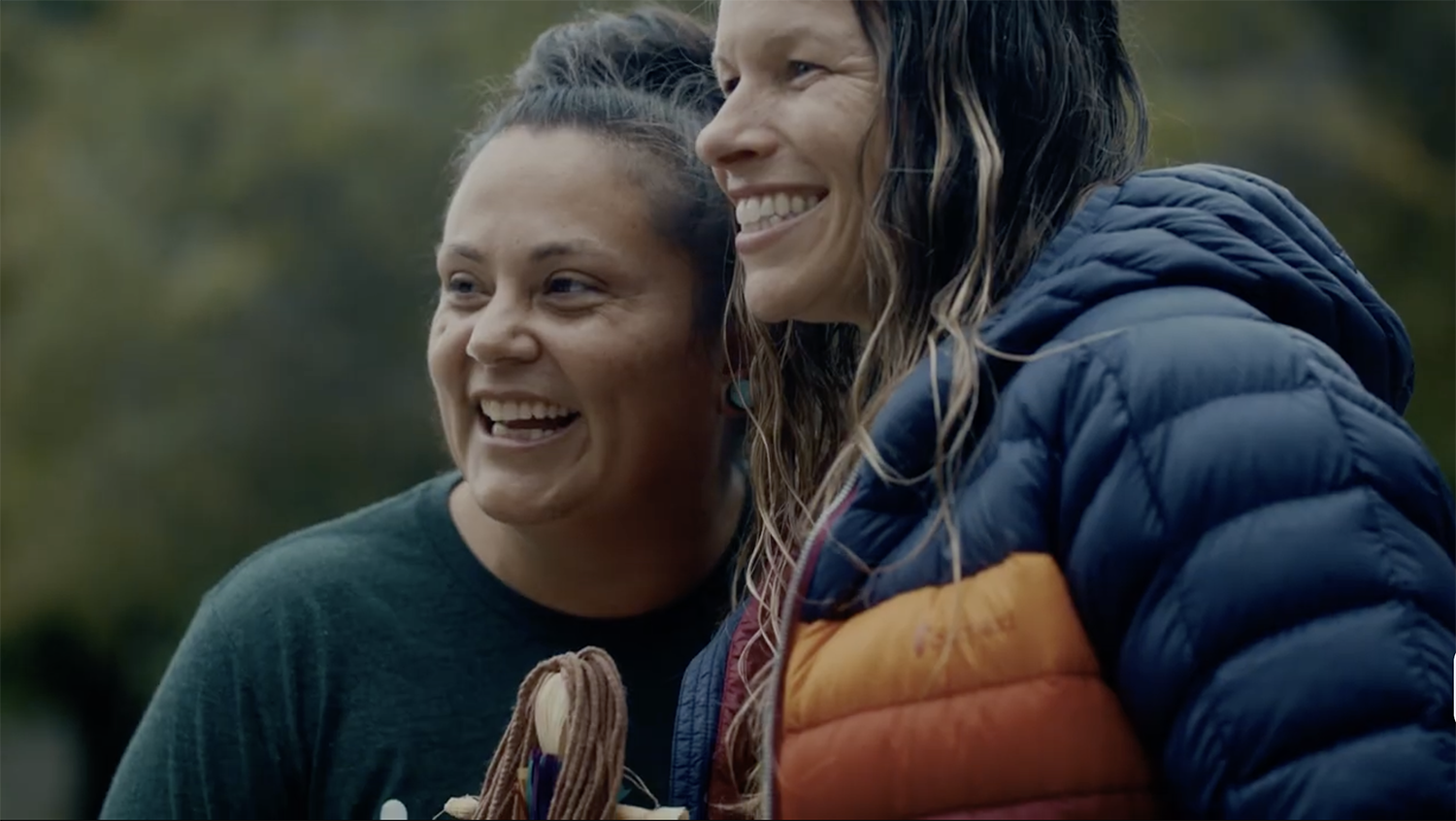 Thumbnail of investing in teachers video. Two Kenan Fellows pose for an outdoor photo.